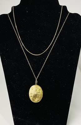 Lot 402 - Two fine 9ct yellow gold chains, combined...