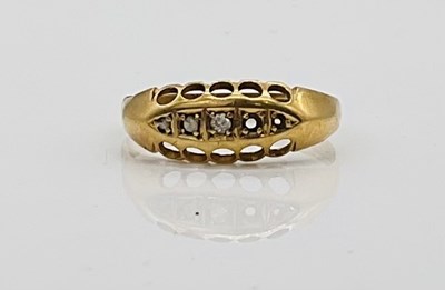Lot 396 - An 18ct yellow gold ring (lacking two stones...