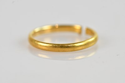 Lot 1554 - A 22k yellow gold cut wedding band,...