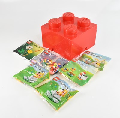 Lot 627 - LEGO; a small LEGO cube storage box containing...