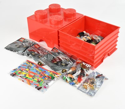 Lot 629 - LEGO; a small red plastic cube storage box...