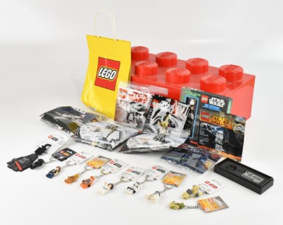 Lot 631 - LEGO; a large red plastic storage box...