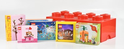 Lot 632 - LEGO; a red rectangular plastic storage...
