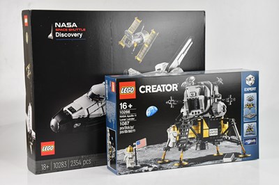 Lot 600 - LEGO; two boxed model kits, 10283 NASA Space...