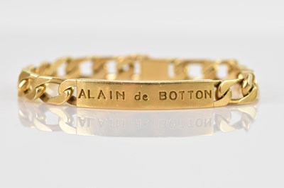 Lot 61 - A yellow metal curb link identity bracelet,...