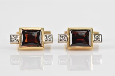 Lot 219 - A pair of yellow metal cufflinks set with a...