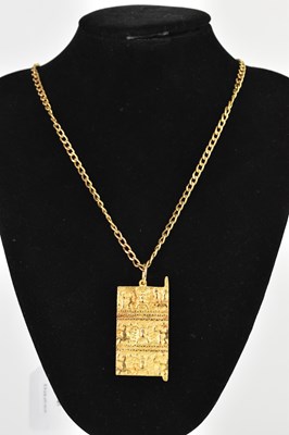 Lot 278 - A yellow metal Egyptian Revival plaque pendant...