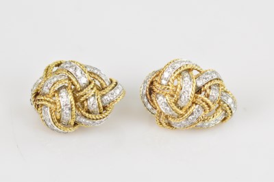 Lot 231 - A pair of yellow metal diamond set knot ear...