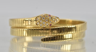 Lot 1443 - A yellow gold expanding coiled snake bracelet,...