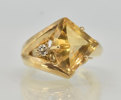 Lot 1218 - A 9ct yellow gold dress ring, with claw set...