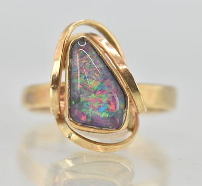 Lot 1242 - A contemporary 9ct yellow gold opal set ring,...