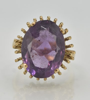 Lot 1235 - A 9ct yellow gold dress ring, with claw set...