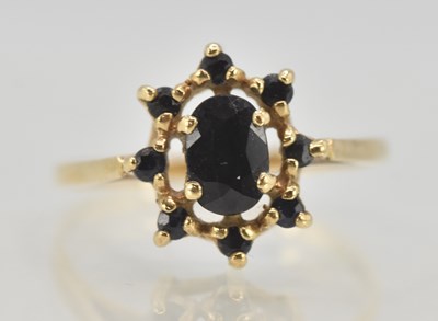 Lot 1306 - A 9ct yellow gold dress ring, with central set...