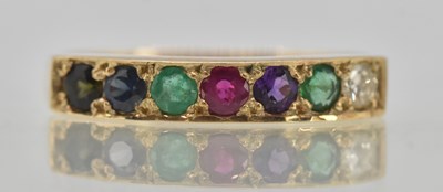 Lot 1307 - A 9ct yellow gold acrostic ring, with the...