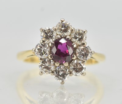 Lot 1214 - An 18ct yellow gold ruby and diamond floral...