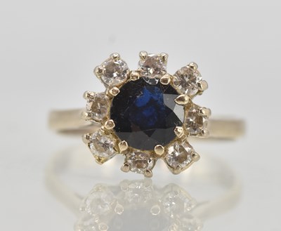 Lot 1215 - An 18ct white gold sapphire and diamond set...