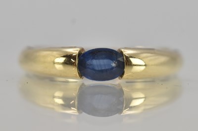 Lot 1308 - A yellow gold dress ring with tension set cut...