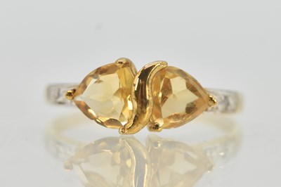 Lot 1320 - A 9ct yellow gold dress ring, with two...