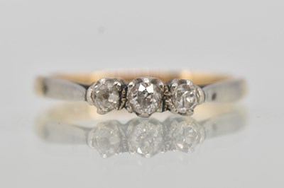 Lot 1321 - A 9ct yellow gold three stone tiny diamond set...