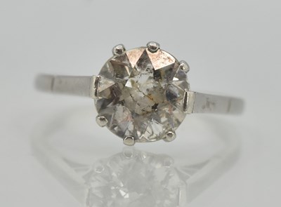 Lot 1185 - A white gold diamond solitaire ring, the claw...