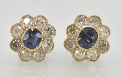 Lot 1414 - A pair of sapphire and diamond set stud...