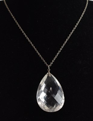 Lot 1385 - A large white cut crystal pendant of pear...