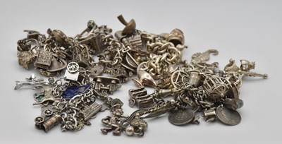 Lot 1478 - Five silver charm bracelets, each with various...
