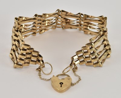 Lot 1455 - A 9ct yellow gold gate link bracelet, with...