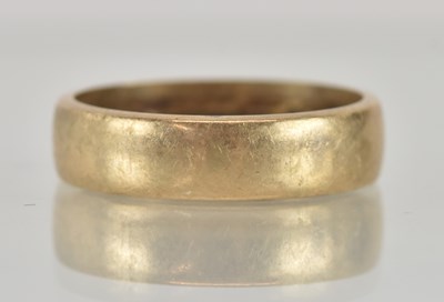 Lot 1246 - A 9ct yellow gold band ring, size P, approx 4.3g.