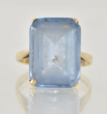 Lot 1270 - A 9ct yellow gold blue topaz set dress ring,...