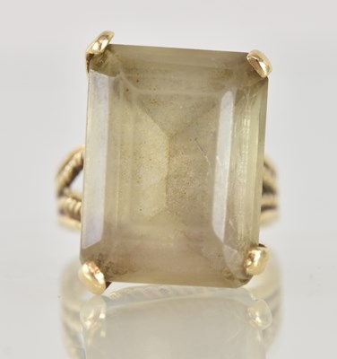 Lot 1247 - A large yellow metal topaz set dress ring, the...