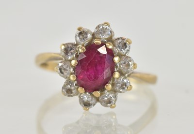 Lot 1249 - A 9ct yellow gold ruby and white stone set...