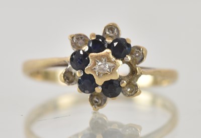 Lot 1292 - A 9ct yellow gold sapphire and diamond flower...