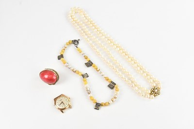 Lot 417 - A double strand pearl necklace set with a...