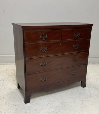 Lot 1115 - A late George III mahogany chest of two short...