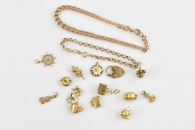 Lot 1545 - Two 9ct gold charm bracelets, with a heart...