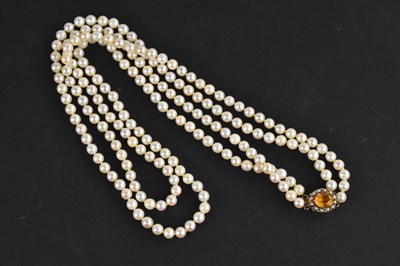 Lot 410 - A double hand knotted string of cultured...