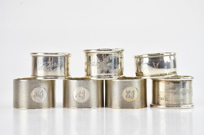 Lot 1508 - Seven hallmarked silver napkin rings, various...