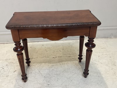 Lot 1116 - A Victorian carved mahogany fold-over tea...