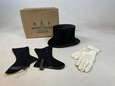 Lot 173 - A Moss Bros top hat, size 7 1/4 with a Herbert...