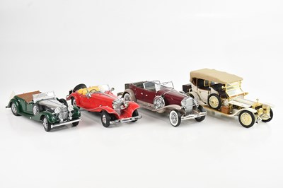 Lot 683 - FRANKLIN MINT; a collection of four cars...