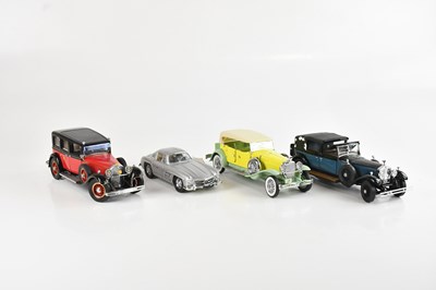 Lot 684 - FRANKLIN MINT; a collection of four model cars...