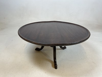 Lot 750 - A 19th century Lazy Susan, oak top on tripod...