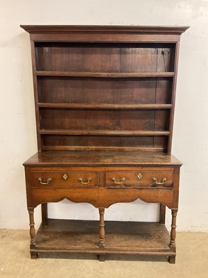 Lot 673 - A small Georgian oak pot board dresser with...
