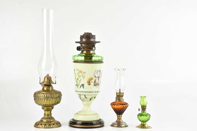 Lot 1309 - A group of four oil lamps including 'The Jr....