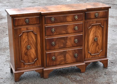Lot 1750 - A small reproduction mahogany breakfront sideboard