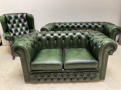 Lot 1051 - A modern green leather Chesterfield style...