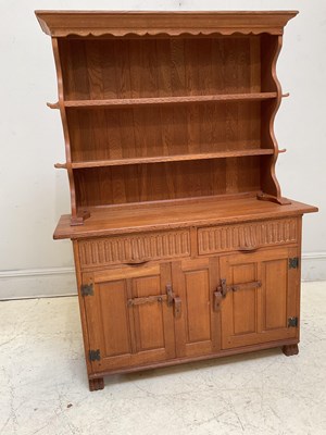Lot 1096 - RUPERT GRIFFITHS; an oak dresser with boarded...