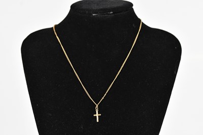 Lot 425 - A 9ct gold cross pendant, suspended on a...