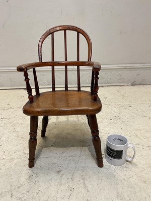 Lot 1119 - A 19th century elm and yew wood child's...